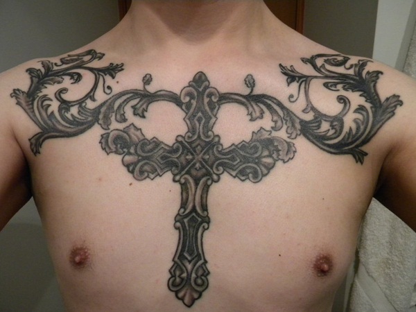 Osneysjc: A tattoo drawn on the muscular chest a skull with crossed horns  forming an X, on the surface of the skin, no 3d effect