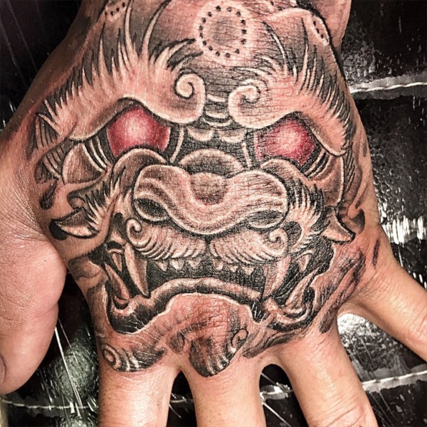 Foo Dog on Hand Tattoo by Diego TattooNOW