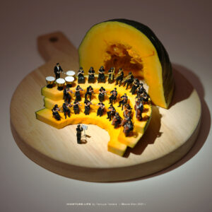 A miniature orchestra performing inside a hollowed-out pumpkin, with tiny musicians playing instruments on slices of pumpkin arranged like steps.